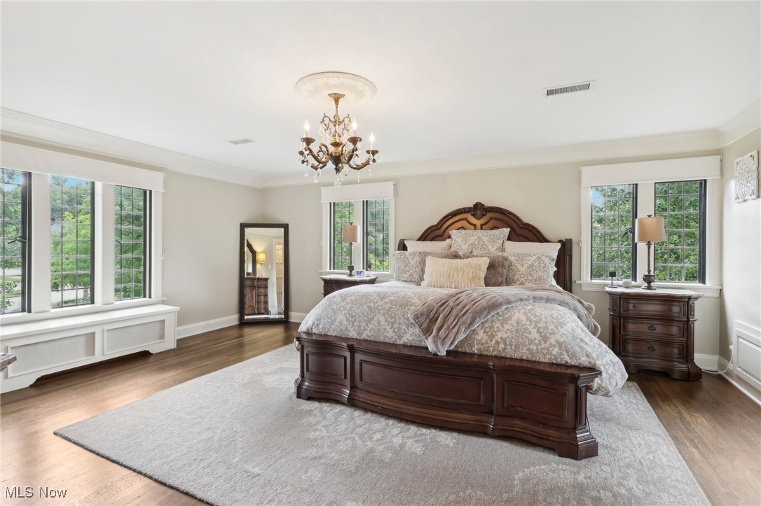 875 Mayfair Road Akron, OH 44303 - Photo 23 of 40 Bedroom with dark hardwood / wood-style flooring, a chandelier, and multiple windows