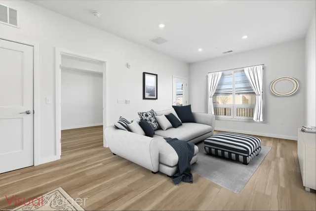 a living room with a couch and a window