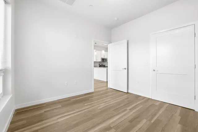 a bathroom with a bathtub shower sink vanity and toilet