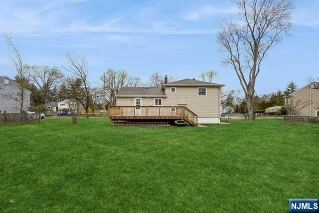 23 Asmus Road Closter, NJ 07624 - Photo 37 of 38 a view of a white house in front of a big yard with large trees