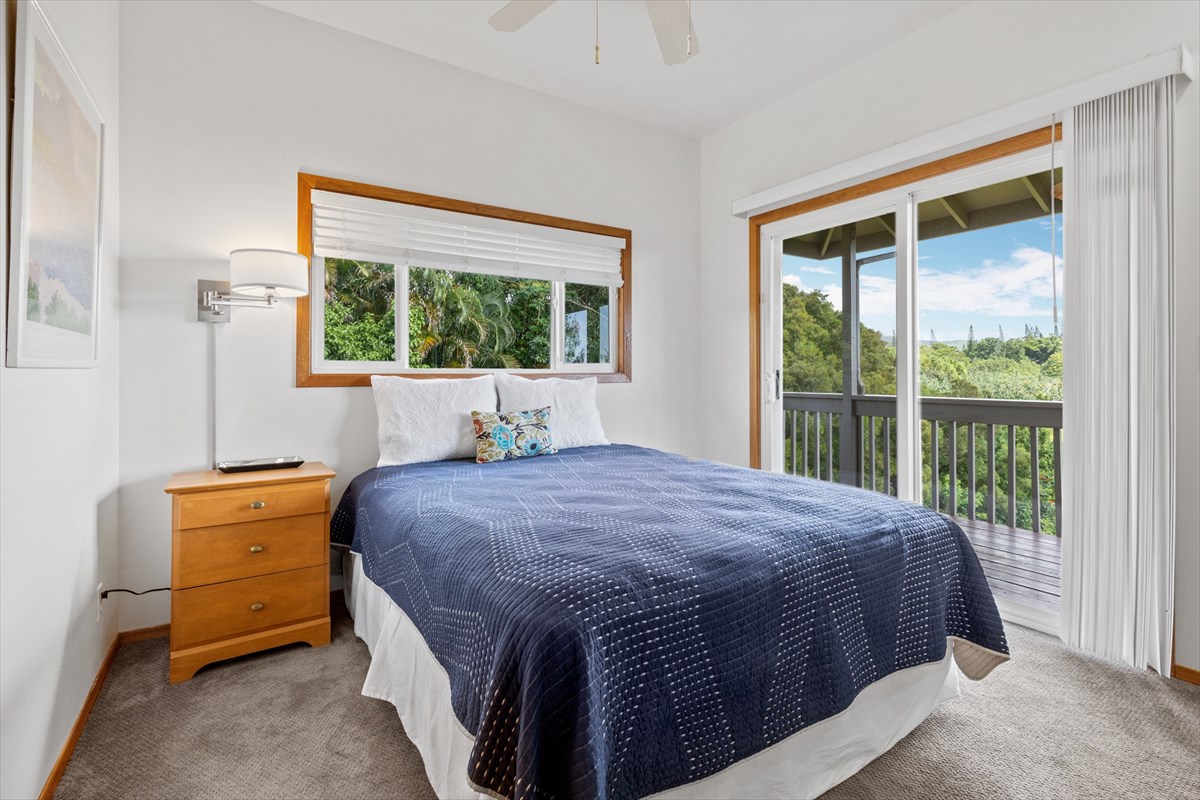 6154 Olohena Road, Unit 2 Kapaa, HI 96746 - Photo 14 of 27 a bedroom with a bed and a window