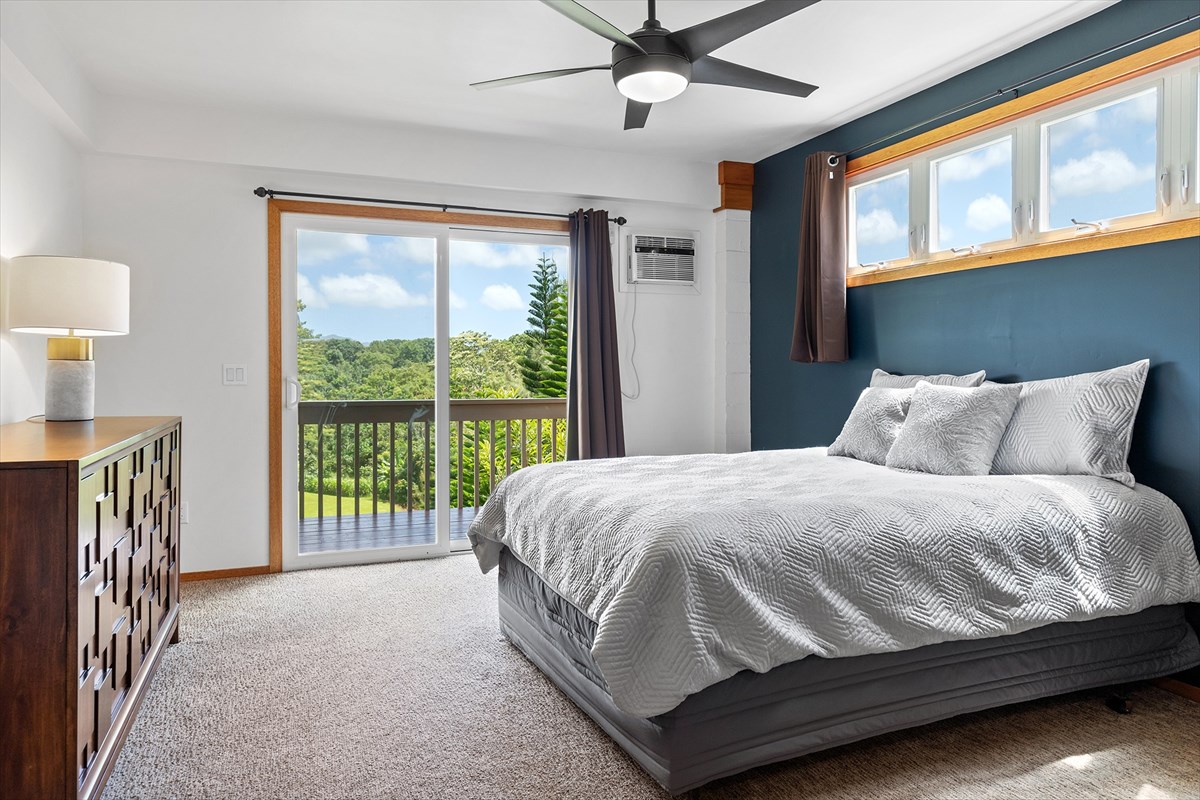 6154 Olohena Road, Unit 2 Kapaa, HI 96746 - Photo 19 of 27 a bed sitting in a bedroom next to a window