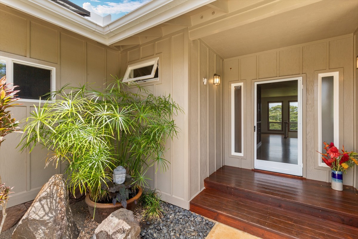 6154 Olohena Road, Unit 2 Kapaa, HI 96746 - Photo 7 of 27 a potted plant sitting in front of a house