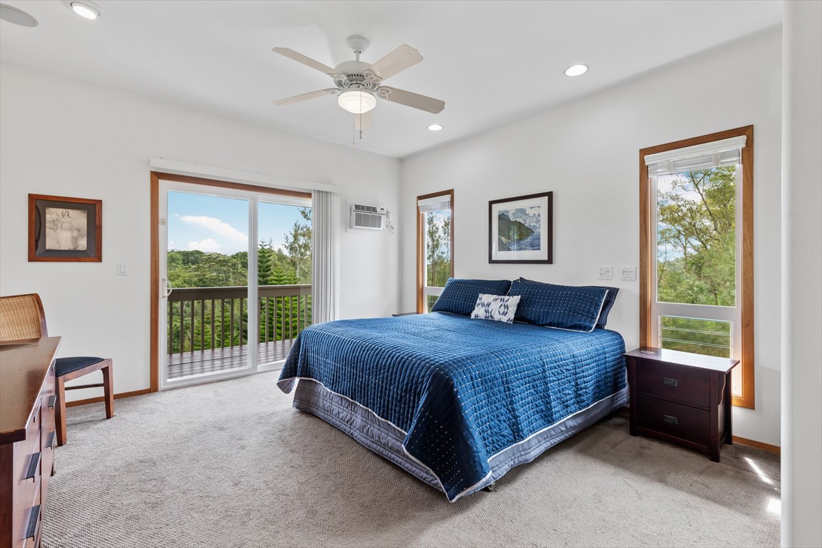 6154 Olohena Road, Unit 2 Kapaa, HI 96746 - Photo 10 of 27 a bed room with a bed and a chair