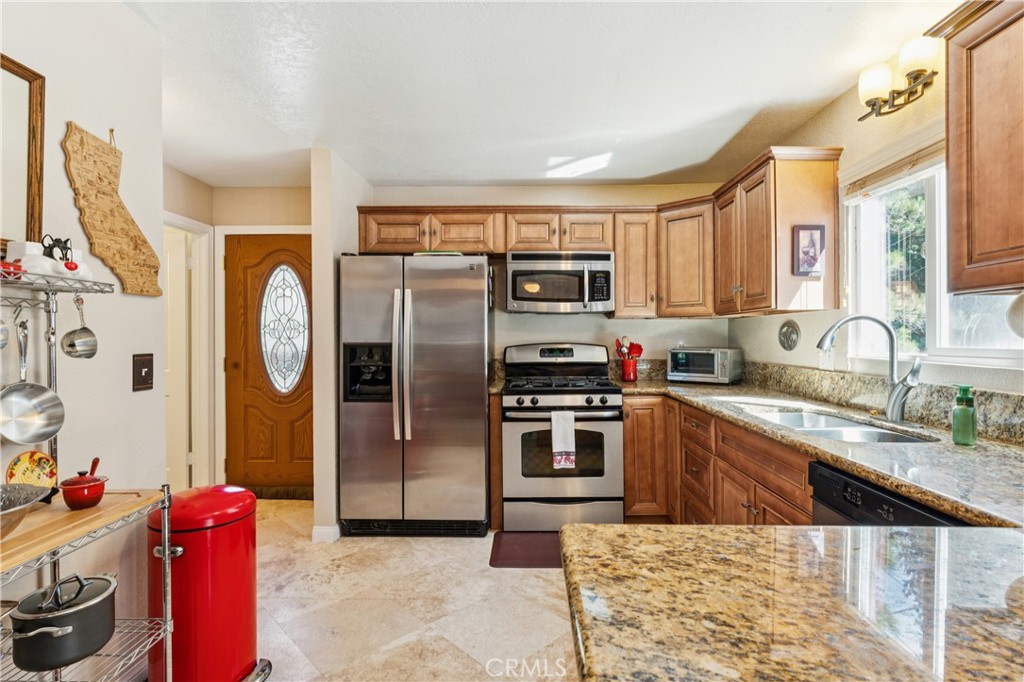 460 Pioneer Road Lake Arrowhead, CA 92352 - Photo 11 of 48 a kitchen with stainless steel appliances granite countertop a refrigerator sink and stove