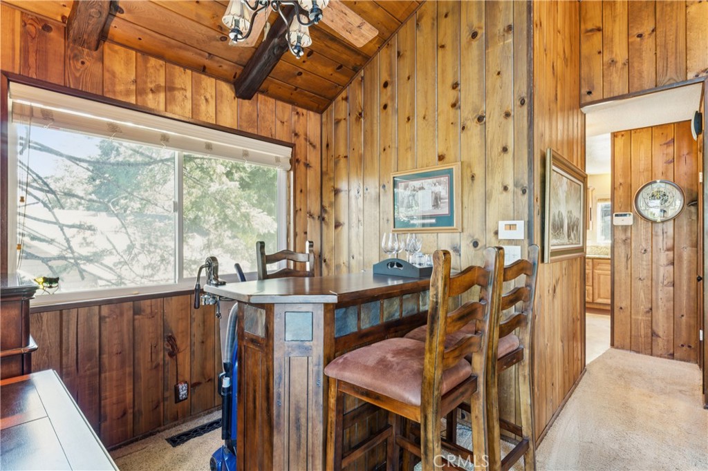 460 Pioneer Road Lake Arrowhead, CA 92352 - Photo 17 of 48 a view of a dining room with furniture window and wooden floor
