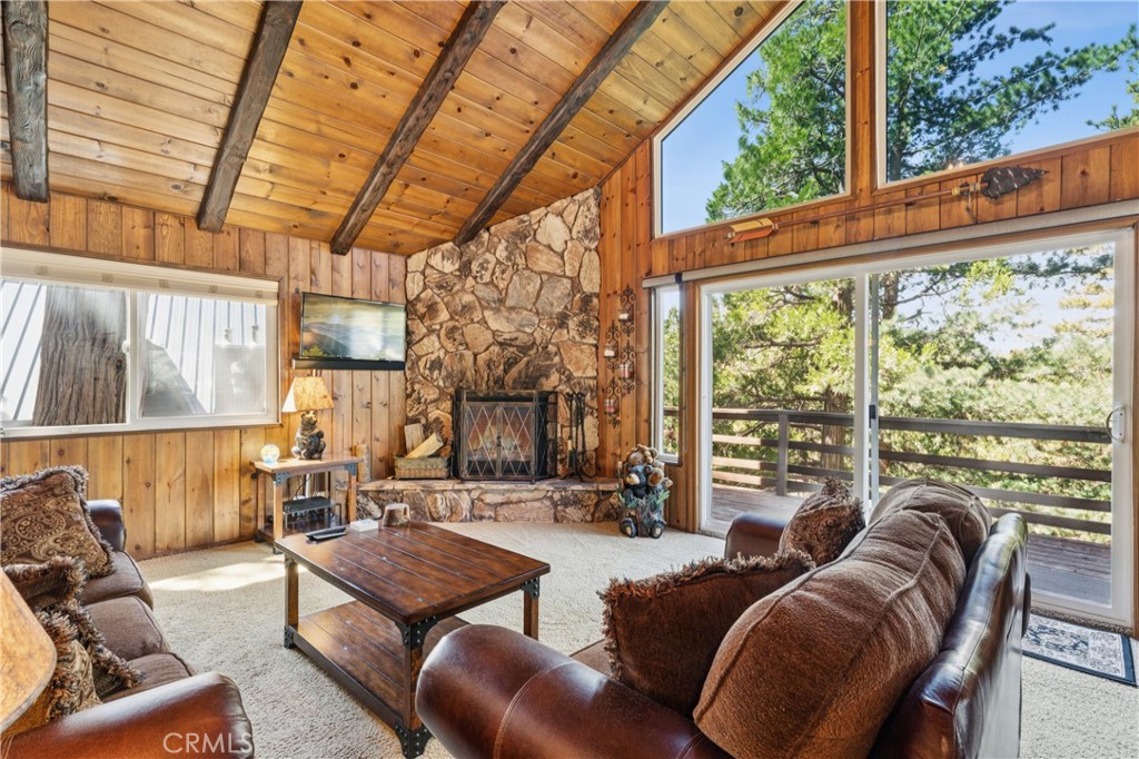 460 Pioneer Road Lake Arrowhead, CA 92352 - Photo 19 of 48 a living room with furniture and a large window