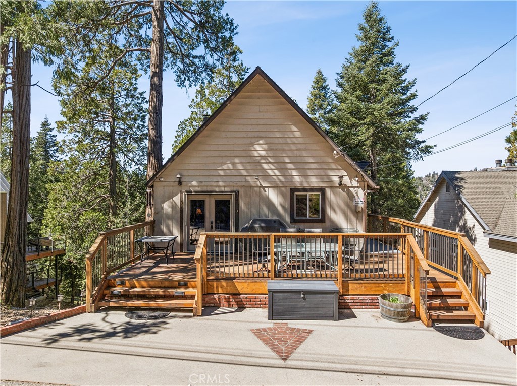 460 Pioneer Road Lake Arrowhead, CA 92352 - Photo 2 of 48 a view of a house with a small yard and wooden fence