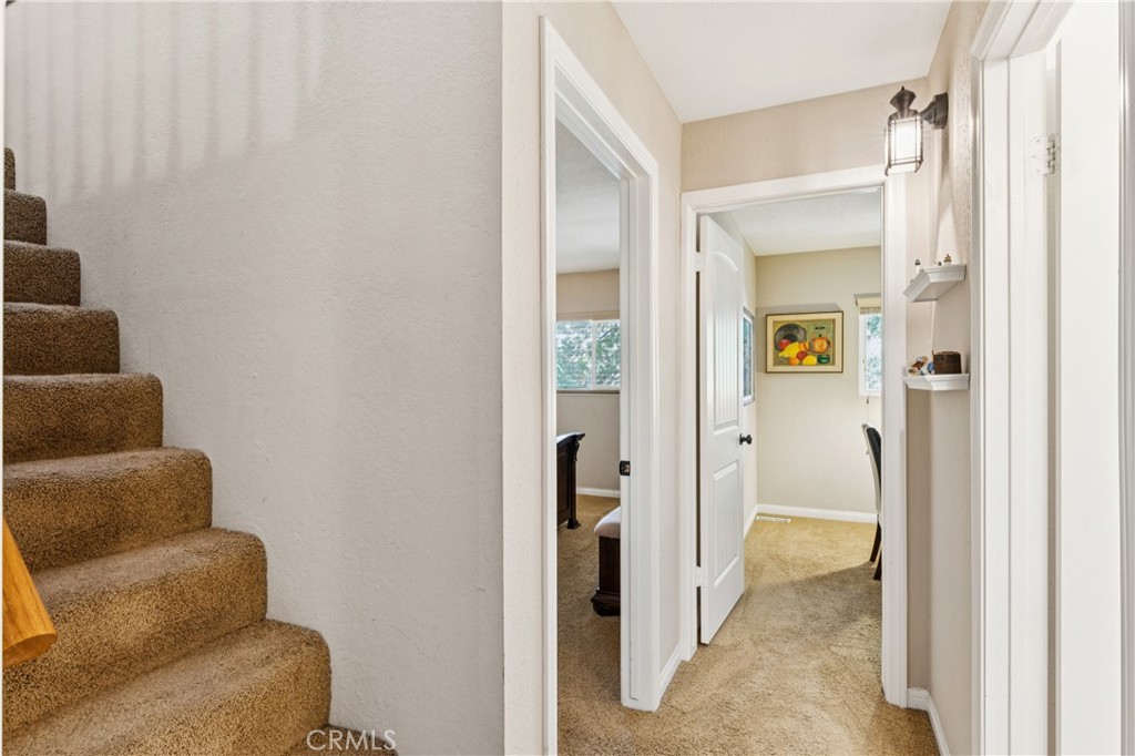 460 Pioneer Road Lake Arrowhead, CA 92352 - Photo 23 of 48 a view of a hallway with furniture and a glass door