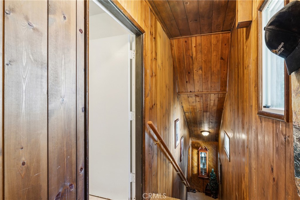 460 Pioneer Road Lake Arrowhead, CA 92352 - Photo 31 of 48 a view of a hallway with wooden floor and staircase