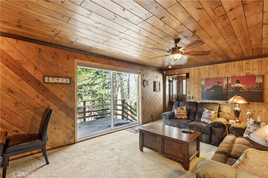 460 Pioneer Road Lake Arrowhead, CA 92352 - Photo 34 of 48 a living room with furniture and a large window