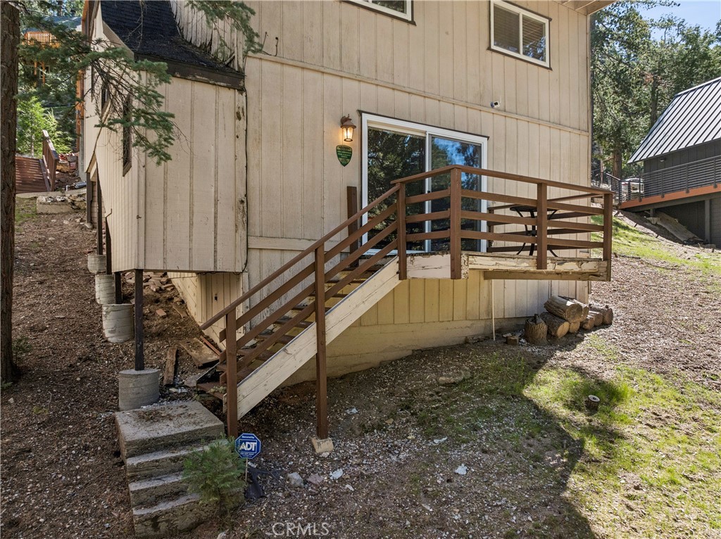460 Pioneer Road Lake Arrowhead, CA 92352 - Photo 40 of 48 a house with trees in front of it