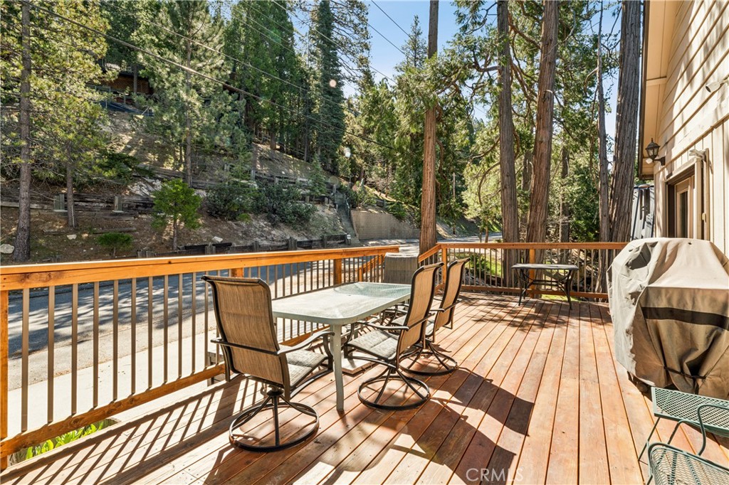 460 Pioneer Road Lake Arrowhead, CA 92352 - Photo 42 of 48 a view of a patio with two chairs and a table