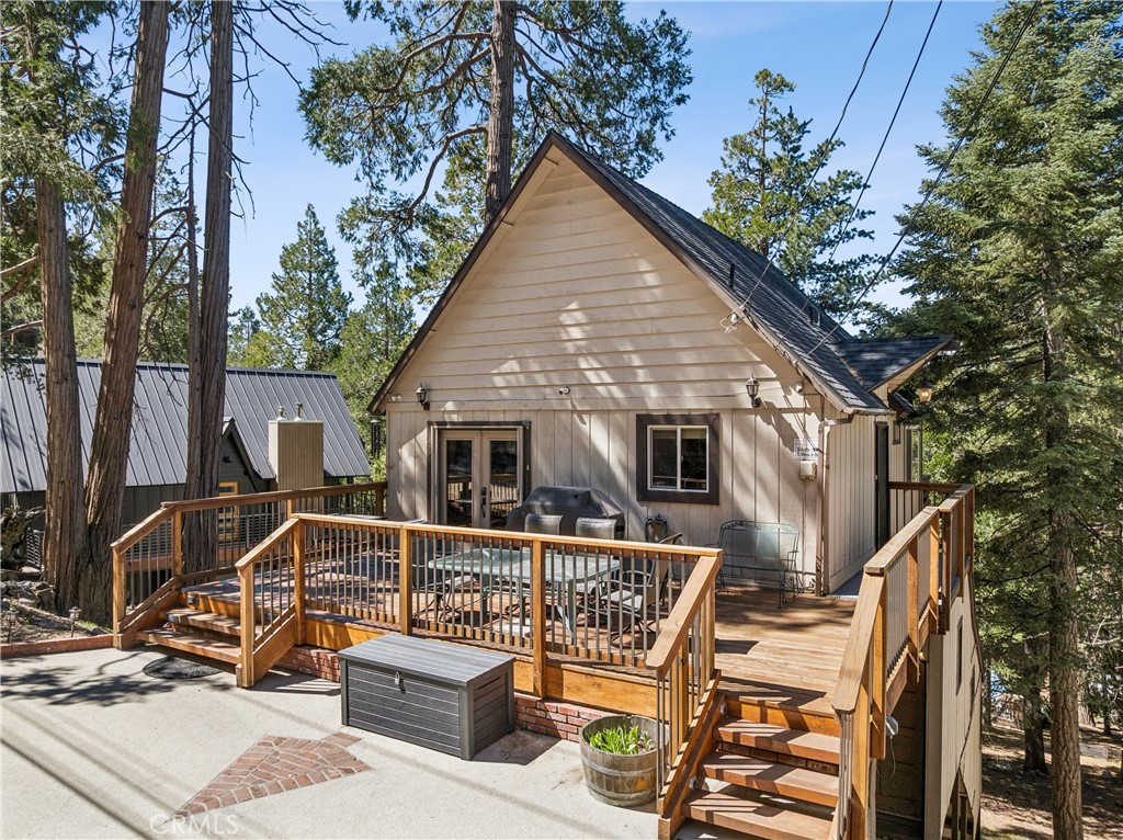 460 Pioneer Road Lake Arrowhead, CA 92352 - Photo 44 of 48 a view of a house with wooden deck and furniture