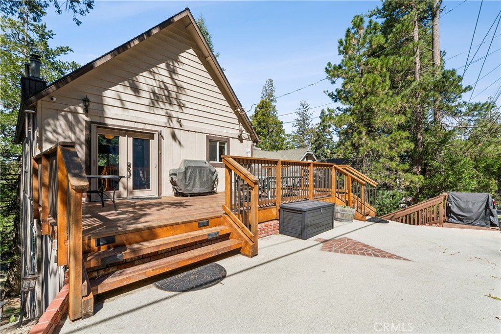 460 Pioneer Road Lake Arrowhead, CA 92352 - Photo 6 of 48 a view of a terrace with chairs and potted plants