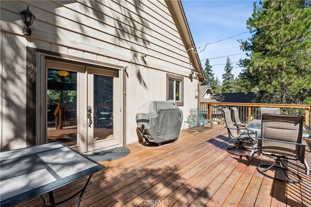 460 Pioneer Road Lake Arrowhead, CA 92352 - Photo 7 of 48 a view of a chairs and table on the deck