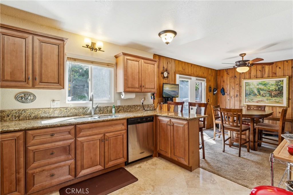 460 Pioneer Road Lake Arrowhead, CA 92352 - Photo 10 of 48 a kitchen with lots of counter top space and center island