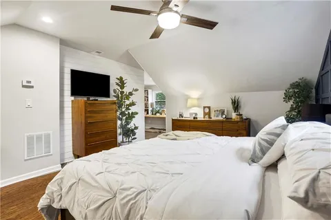 a bathroom with a sink a toilet and shower curtain