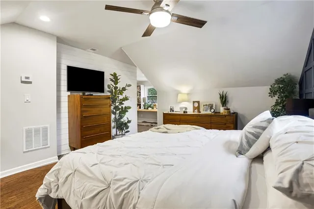 a bathroom with a sink a toilet and shower curtain
