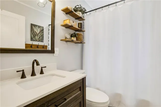 a room with furniture a large window and gym equipment