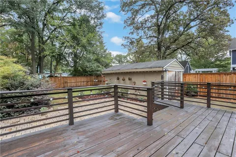 a view of a backyard with wooden floor