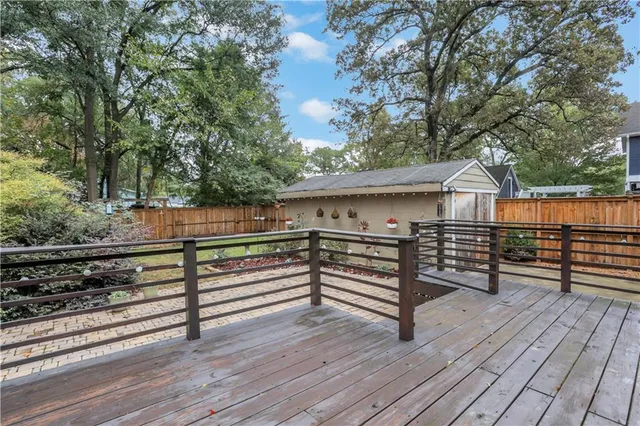 a view of a backyard with wooden floor