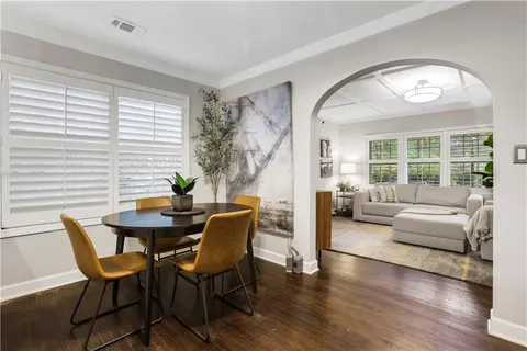 a view of a livingroom with furniture and a large window