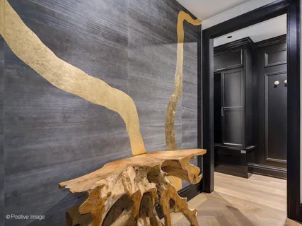 a bedroom with a bed and a mirror