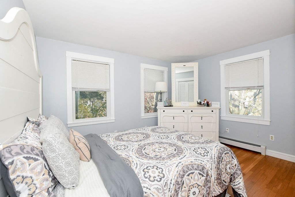 150 Herring Pond Road Bourne, MA 02532 - Photo 17 of 42 a bedroom with a large bed and a window
