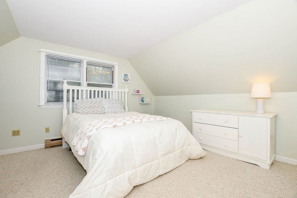 150 Herring Pond Road Bourne, MA 02532 - Photo 20 of 42 a bedroom with a bed and a night stand