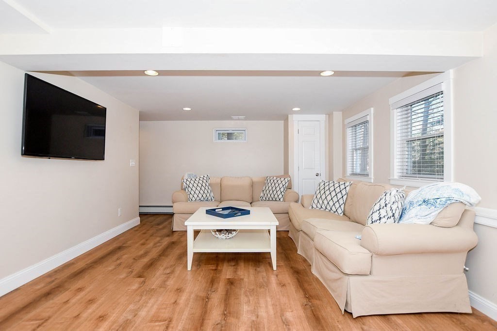 150 Herring Pond Road Bourne, MA 02532 - Photo 26 of 42 a living room with furniture and a flat screen tv