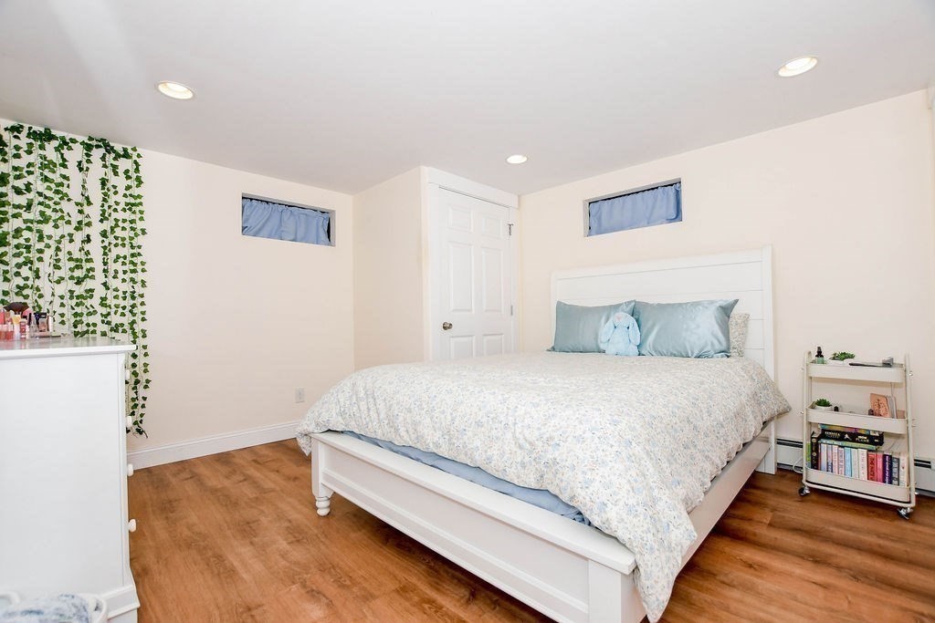 150 Herring Pond Road Bourne, MA 02532 - Photo 30 of 42 a bedroom with a bed and a night stand