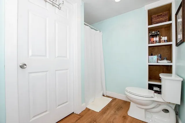 a white toilet sitting next to a bathroom sink