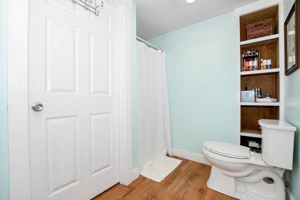 150 Herring Pond Road Bourne, MA 02532 - Photo 32 of 42 a white toilet sitting next to a bathroom sink