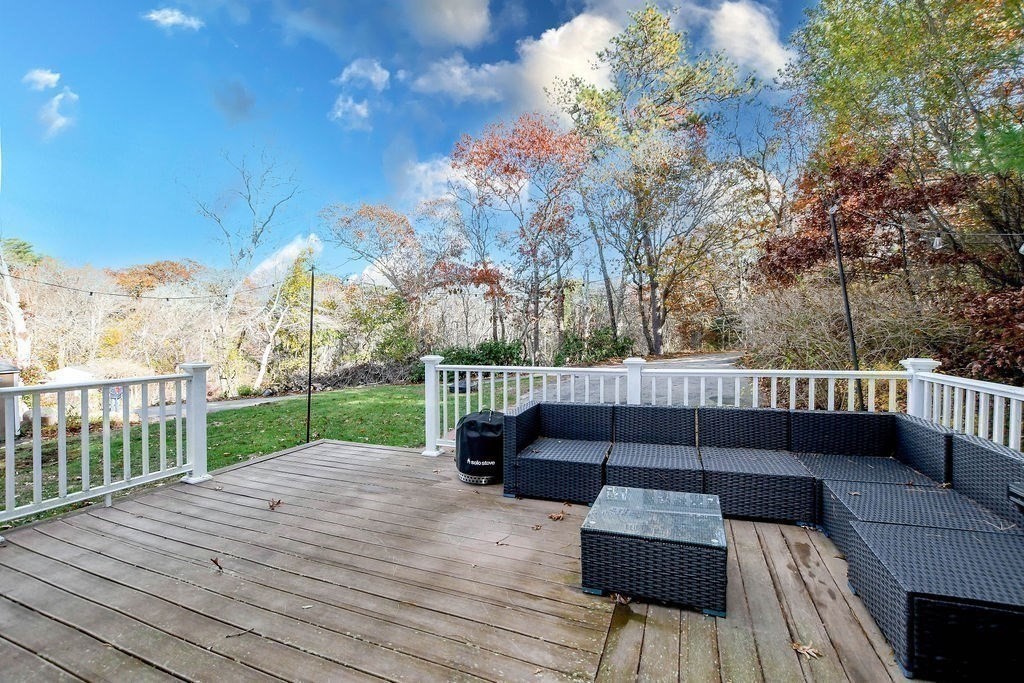 150 Herring Pond Road Bourne, MA 02532 - Photo 39 of 42 a view of a deck with couches and wooden fence