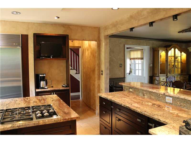 Kitchen. O[en concept Kitchen and DR maintains formal integrity of home but functions beautifully for relaxed entertaining