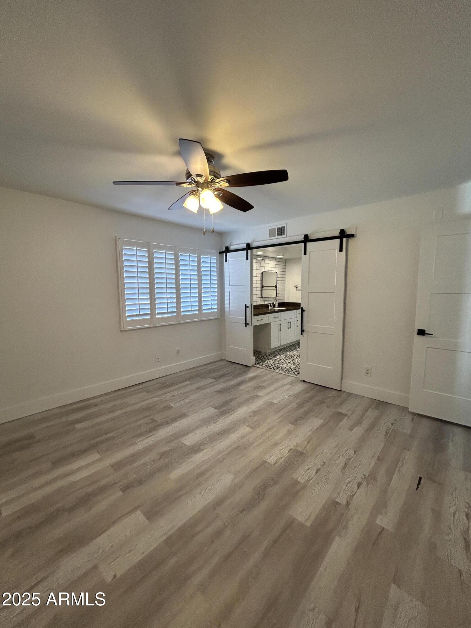 320 East Larkspur Lane Tempe, AZ 85288 - Photo 11 of 16 a view of an empty room with a window
