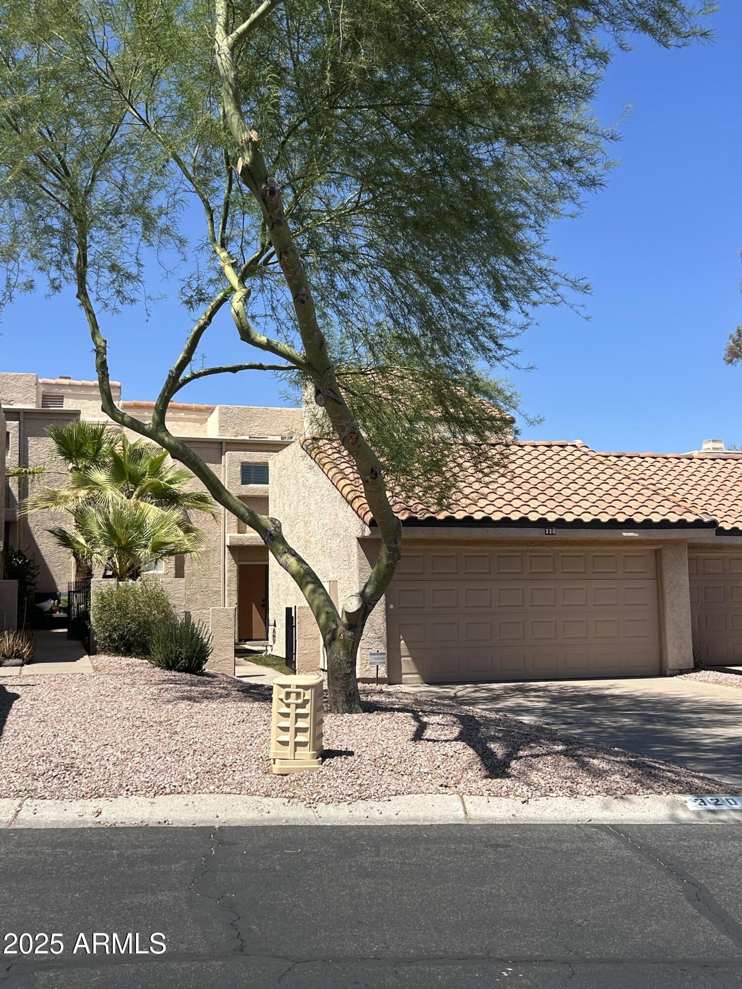 320 East Larkspur Lane Tempe, AZ 85288 - Photo 15 of 16 a view of a house with a yard