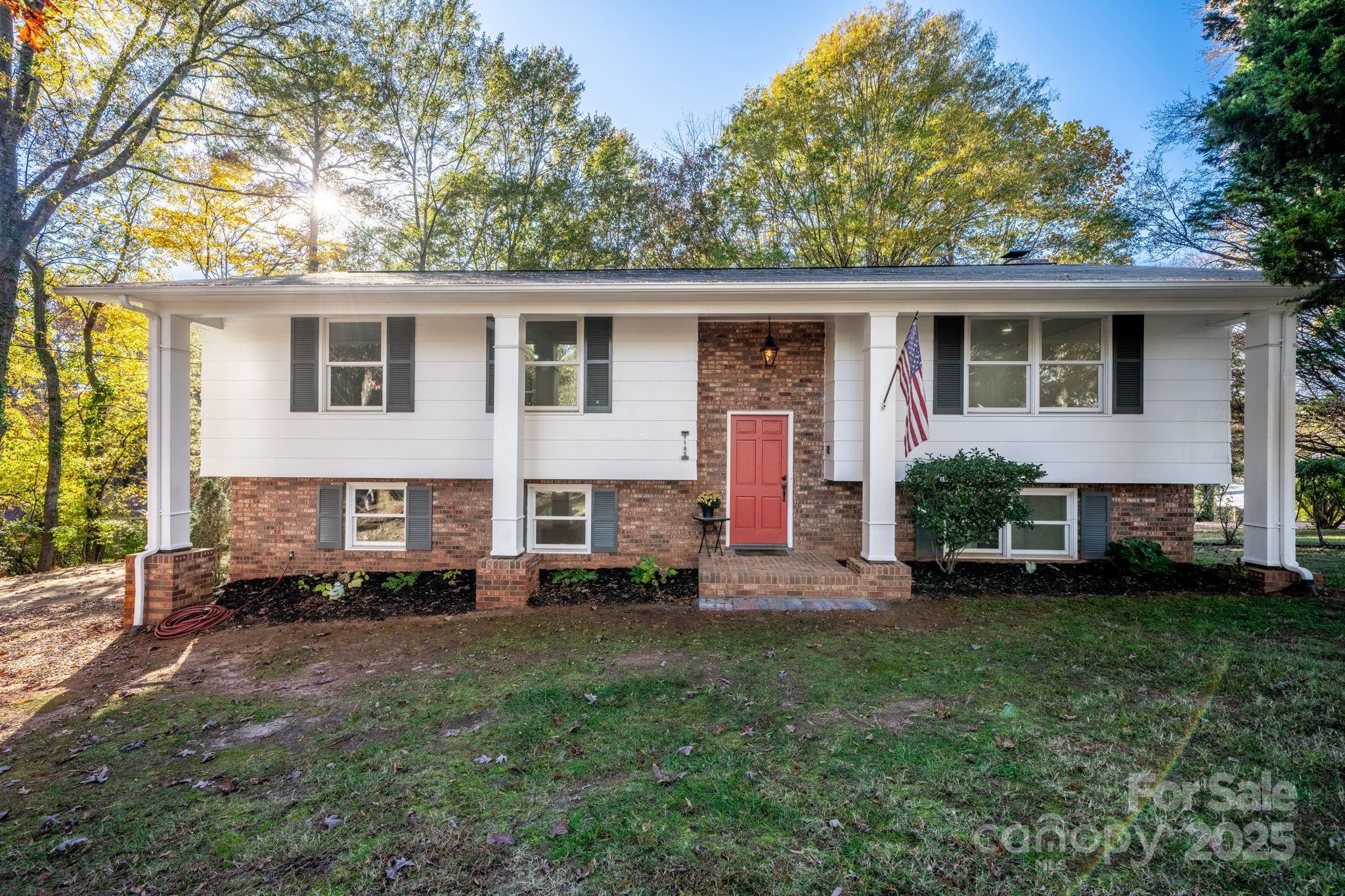 1185 10th St Pl Circle Northwest Hickory, NC 28601 - Photo 1 of 38 a view of a house with a yard and sitting area
