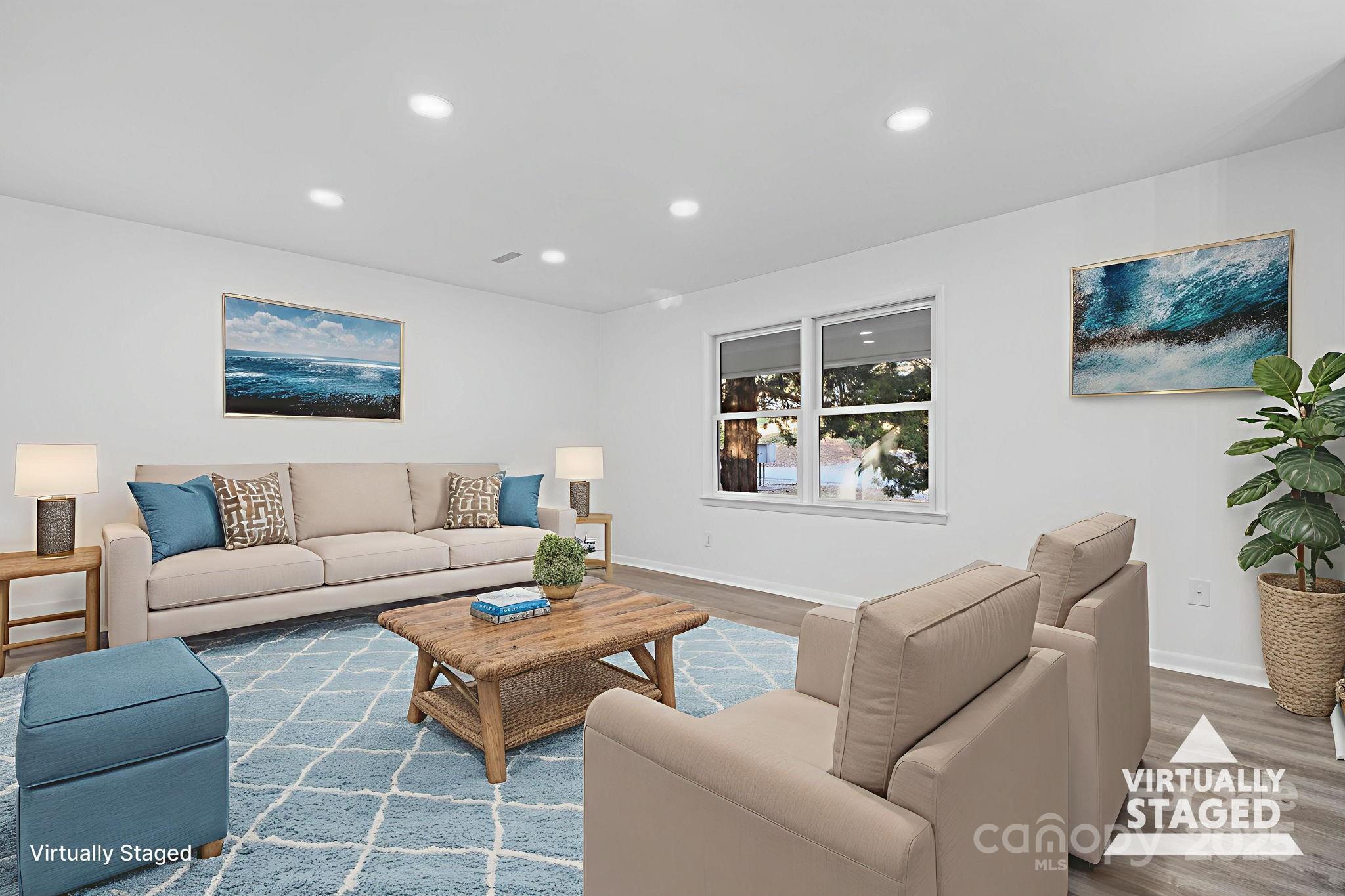 1185 10th St Pl Circle Northwest Hickory, NC 28601 - Photo 13 of 38 a living room with furniture and a painting on the wall
