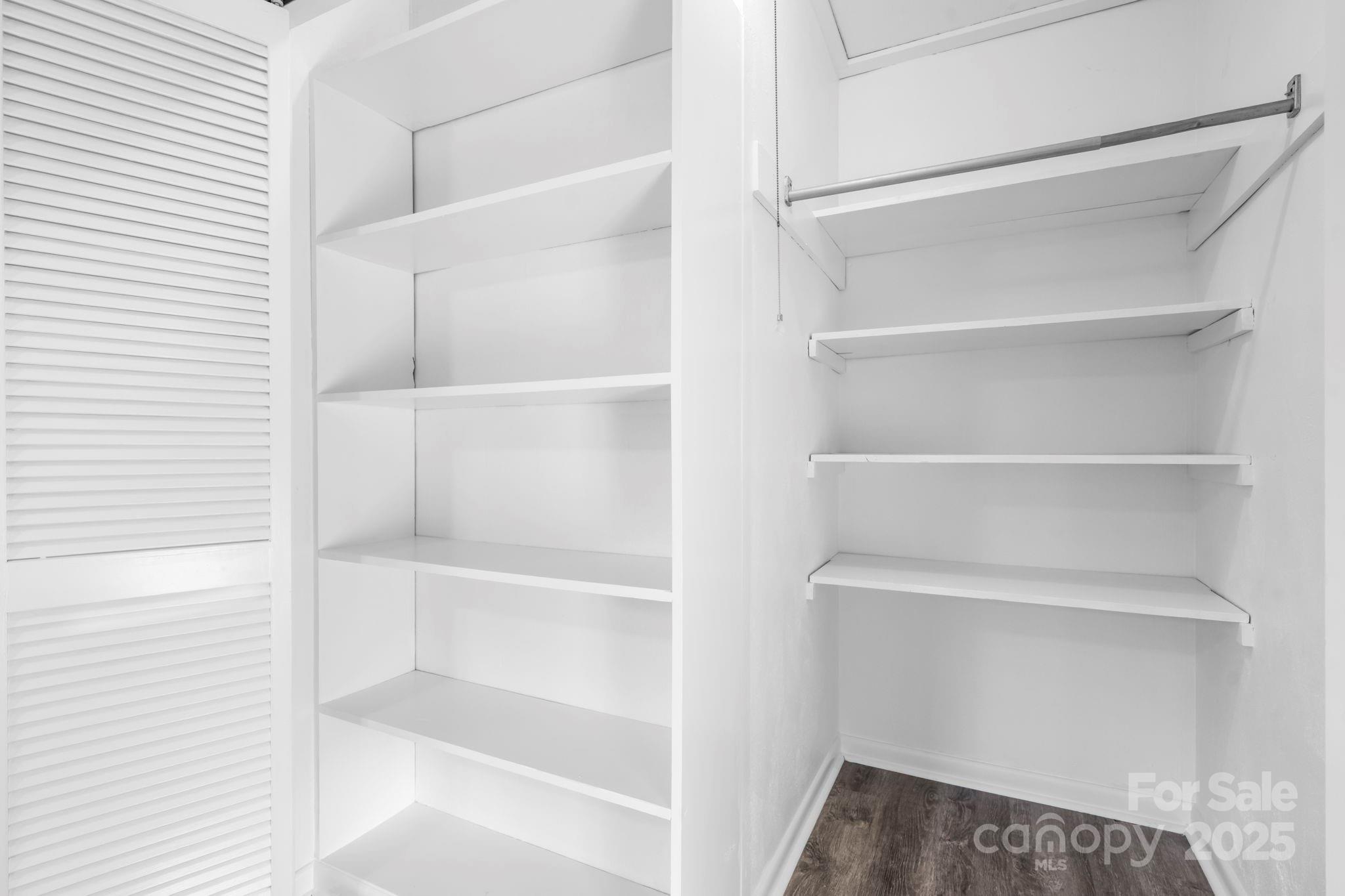1185 10th St Pl Circle Northwest Hickory, NC 28601 - Photo 19 of 38 a view of walk in closet with empty racks