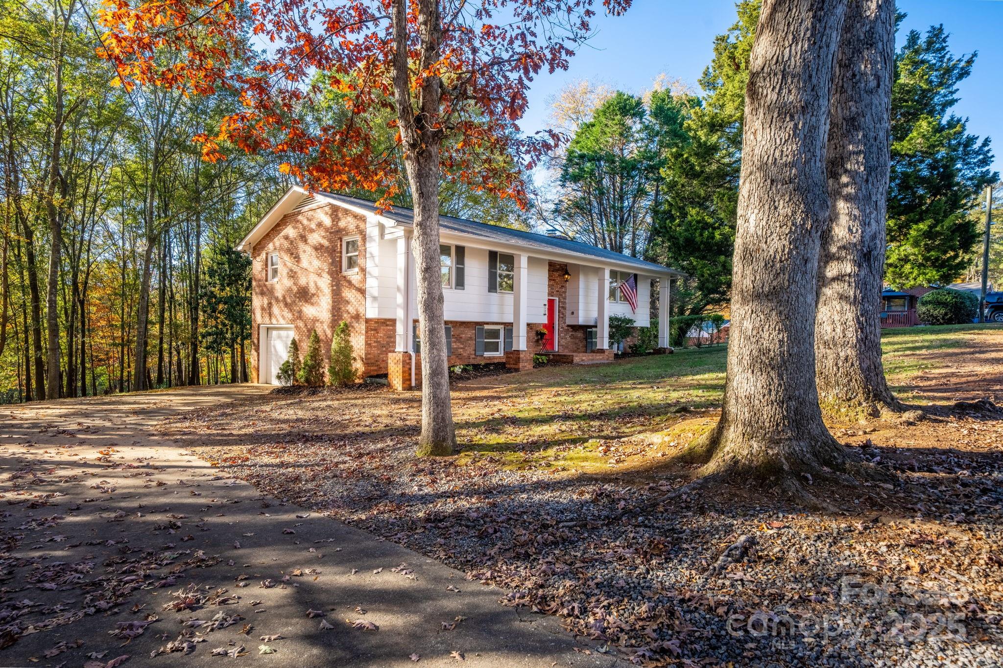 1185 10th St Pl Circle Northwest Hickory, NC 28601 - Photo 2 of 38 a view of a house with a backyard