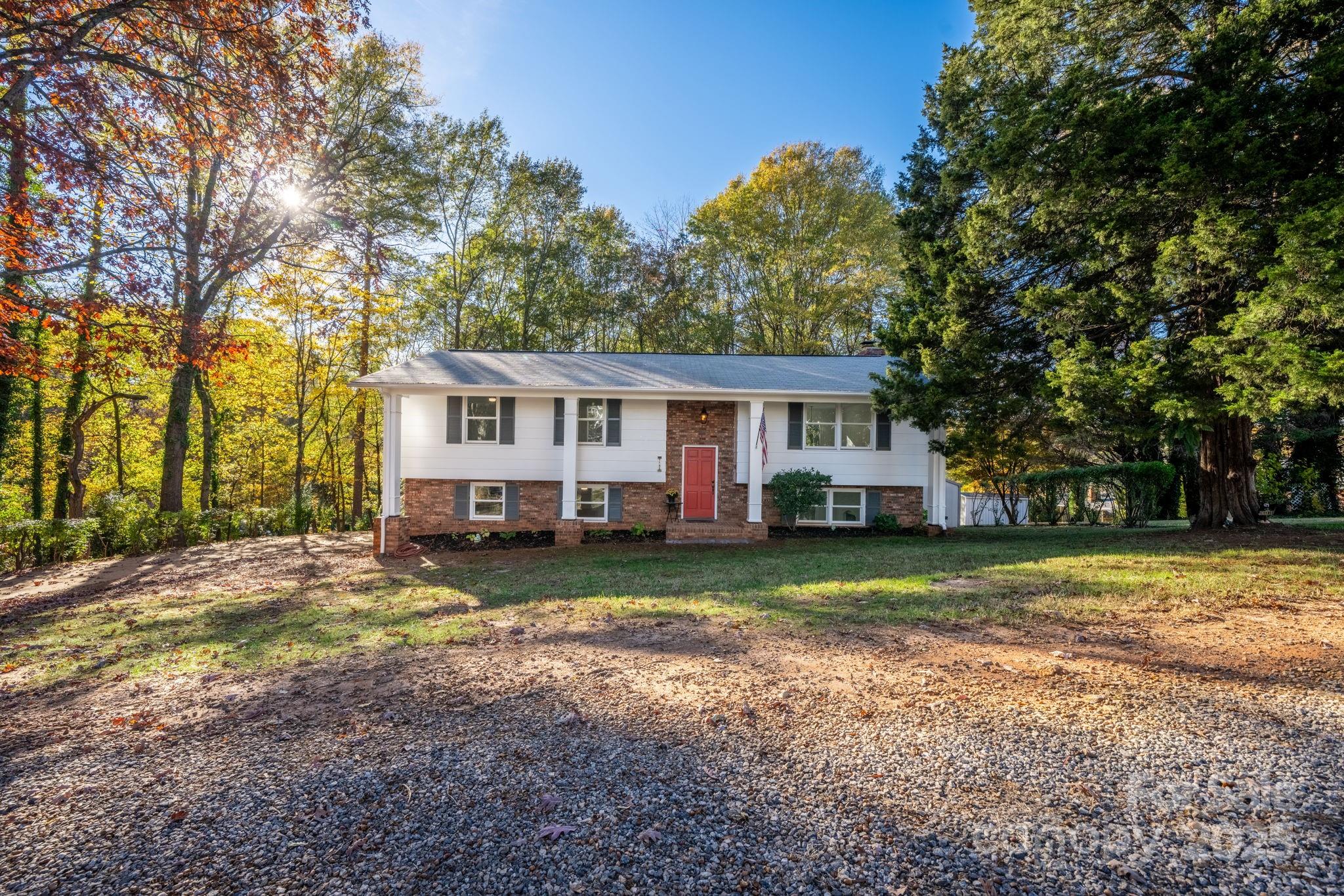 1185 10th St Pl Circle Northwest Hickory, NC 28601 - Photo 31 of 38 a view of a house with a yard and large tree