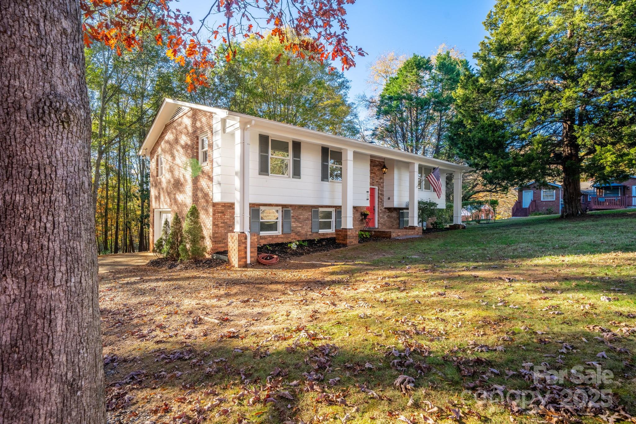 1185 10th St Pl Circle Northwest Hickory, NC 28601 - Photo 32 of 38 a view of a house with a yard