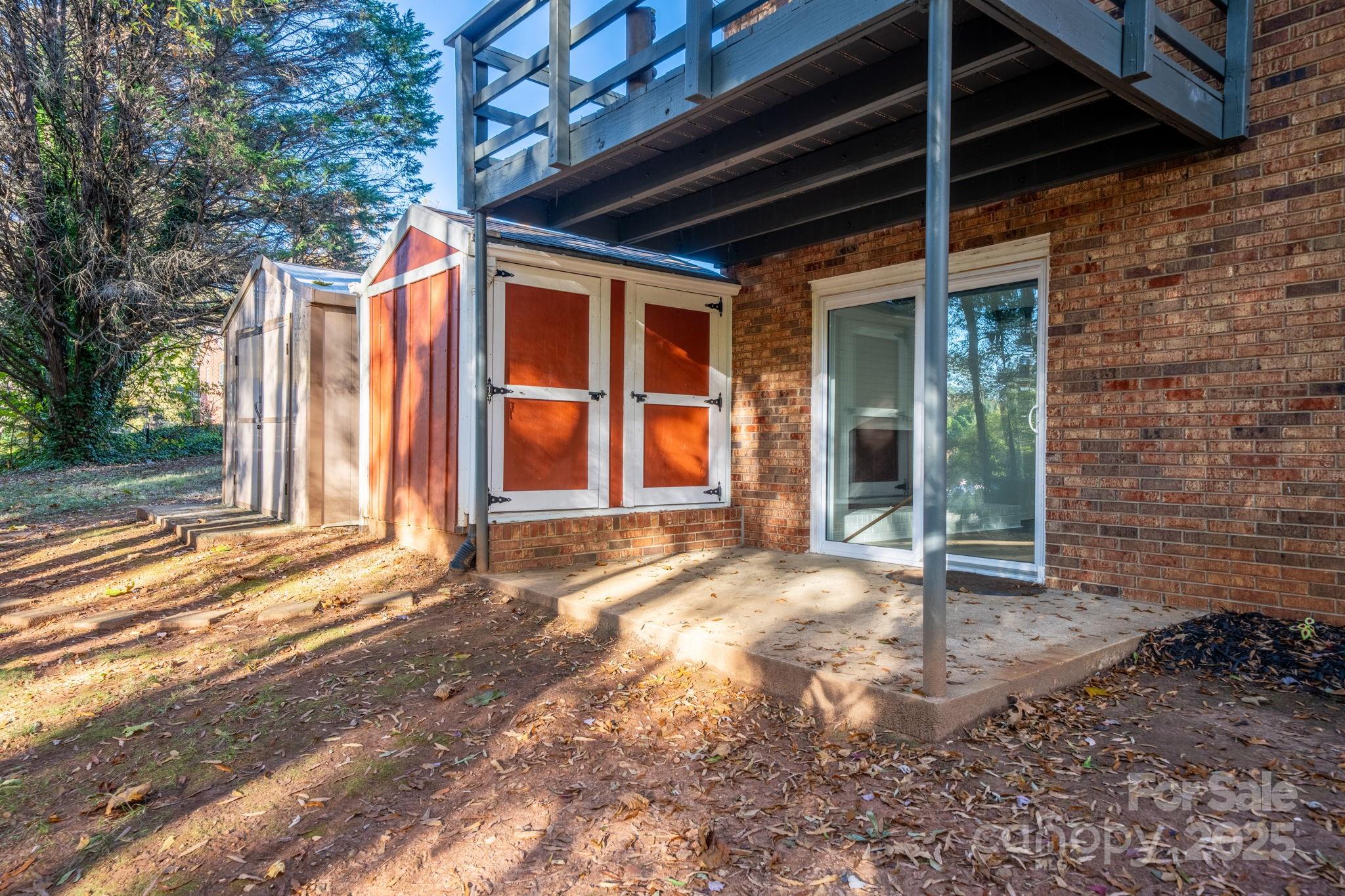 1185 10th St Pl Circle Northwest Hickory, NC 28601 - Photo 34 of 38 a view of a backyard with a large tree