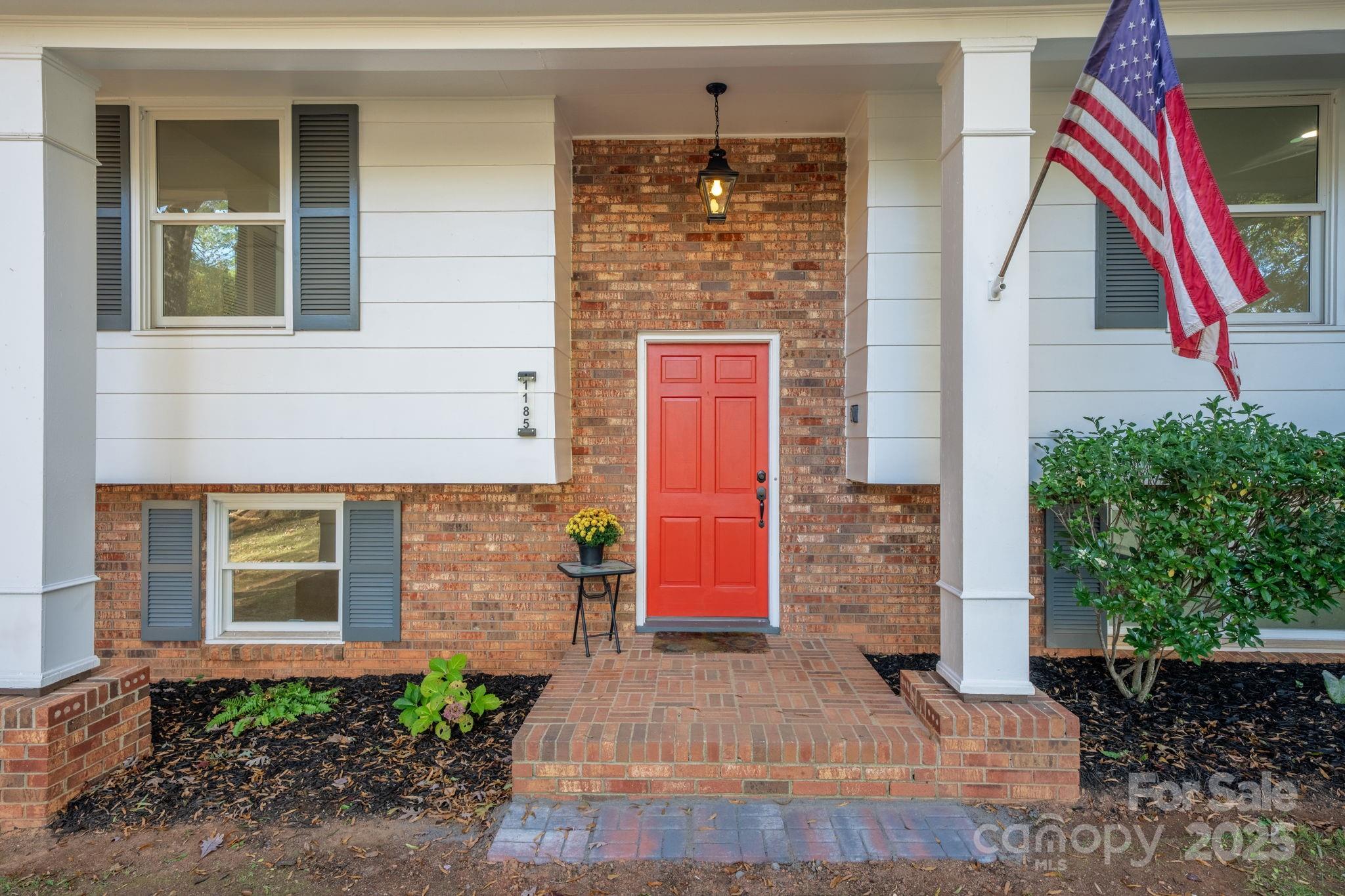 1185 10th St Pl Circle Northwest Hickory, NC 28601 - Photo 4 of 38 a front view of a house with a yard