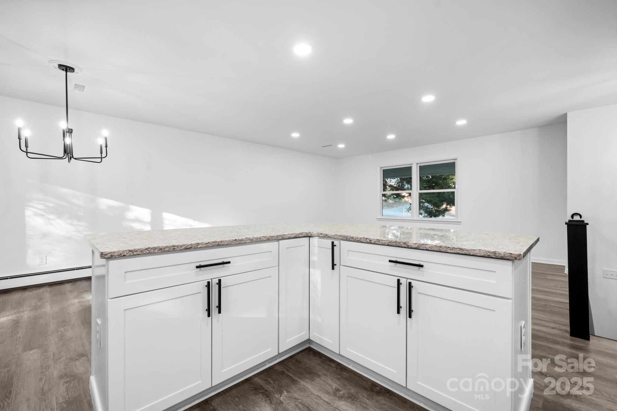 1185 10th St Pl Circle Northwest Hickory, NC 28601 - Photo 10 of 38 a kitchen with white cabinets and sink