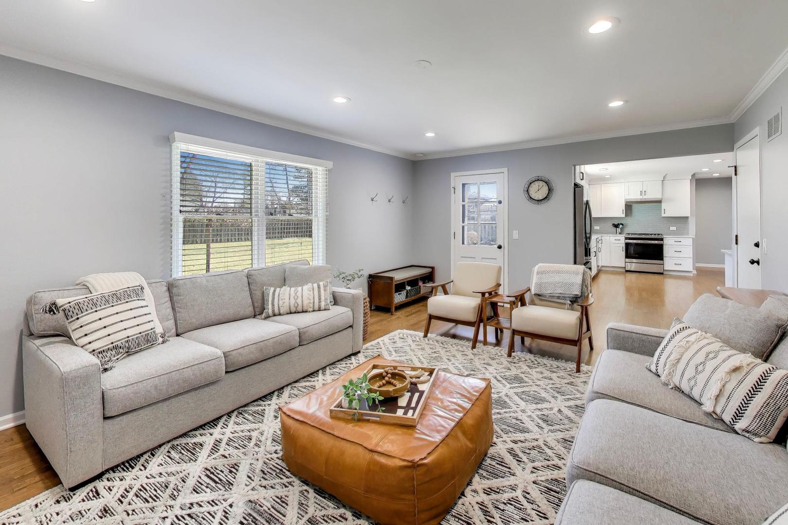 1445 Stoddard Avenue Wheaton, IL 60187 - Photo 11 of 38 a living room with furniture and a large window