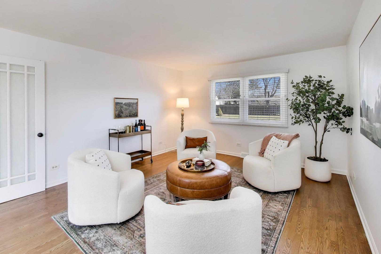 1445 Stoddard Avenue Wheaton, IL 60187 - Photo 13 of 38 a living room with furniture and a potted plant