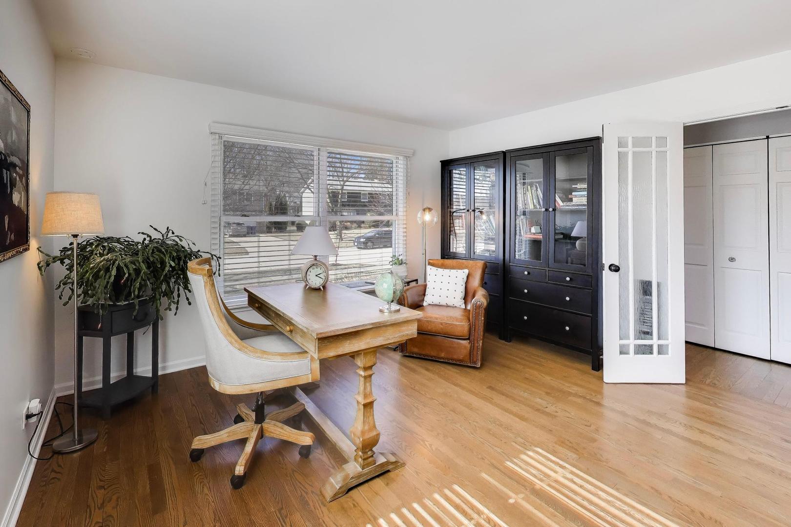 1445 Stoddard Avenue Wheaton, IL 60187 - Photo 14 of 38 a living room with furniture and a potted plant